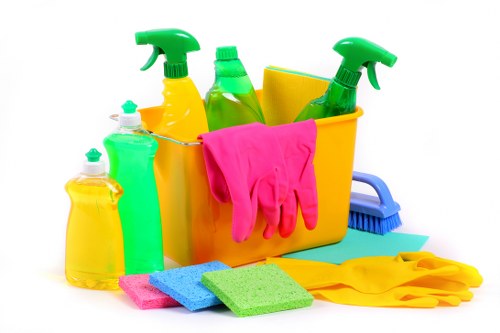 Cleaning staff performing detailed commercial cleaning in a business setting